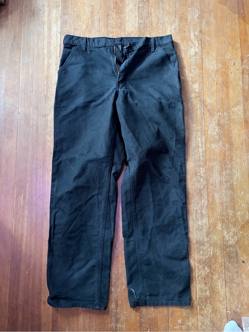 Men's black Carhartt duck wash carpenter pants